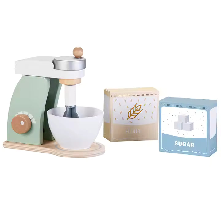 Children's toy kitchen mixer set with a wooden base, white bowl, and green accents, along with pretend sugar and flour containers.
