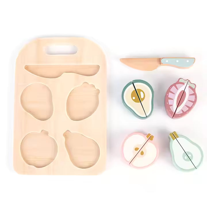 A wooden cutting board with colorful, realistic-looking fruit pieces arranged on top of it, and a wooden knife beside them.