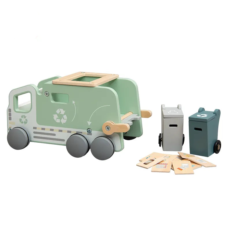 A wooden recycling truck toy with green accents and recycling symbols, alongside two recycling bins and sorting tiles.