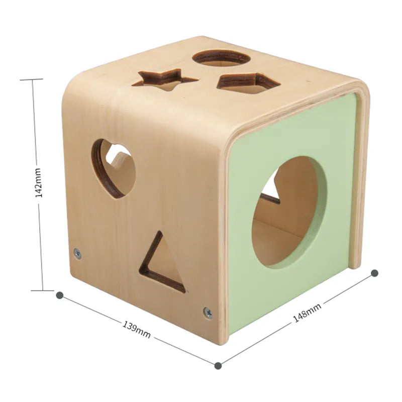 A wooden shape sorting cube with various holes for shapes, and colorful numbered shapes being inserted by a hand. Measures:142cm*139cm*148cm